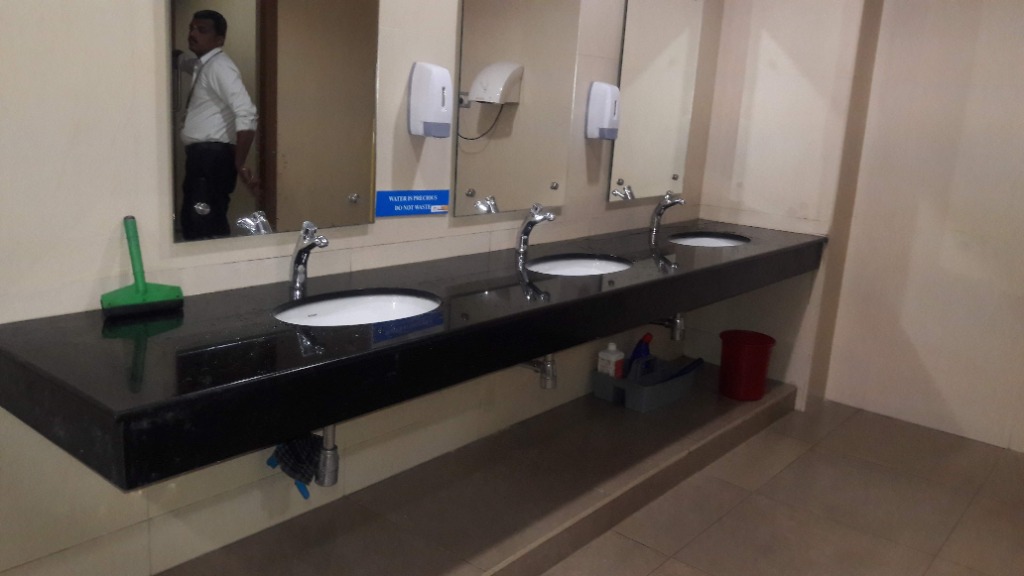 Modern Commercial Washroom Basin and Mirror Setup